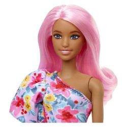 Barbiedocka med benprotes och blommig klänning